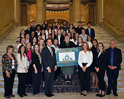 Social work students and faculty from Northwestern Oklahoma State University and Oral Roberts University are pictured with Oklahoma Lt. Governor Matt Pinnell (center left) and Rebekah Williams (center right), Ombudsman Systems Advocate.