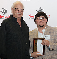 Baylan Bird (right) receives the John Ted Meier Student Teaching award